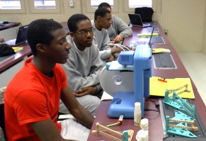 Students with a 3D printer at the DC Capital Guardian Youth ChalleNGe Academy