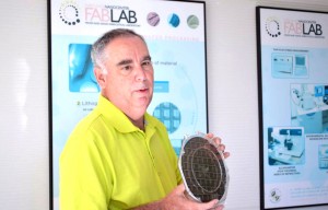 University of Maryland FabLab Director Jim O'Connor holds a silicon disk