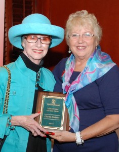 YouthQuest Co-Founder and President Lynda Mann presents Chris Eaton's Volunteer of the Year Award to his mother, Betty Eaton