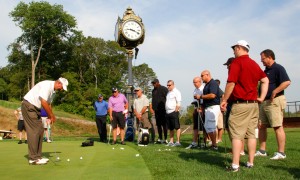 Golf Entertainer Brad Denton demonstrates putting techniques at the 2014 Challenge at Trump National