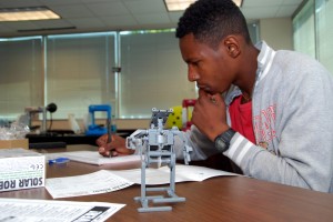 Daikwon Jones dreams up ways to customize the robot he just assembled.