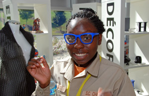 Sherquana Adams tries on 3D-printed eyeglasses during a visit to 3D Systems headquarters in Rock Hill, SC.