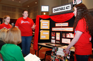 Allison Ball, Kelsey Clark and Hannah Ratcliffe explain their project, Charitable Act, at the 2015 Step Up Loudoun Youth Competition