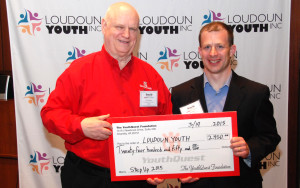 YouthQuest Director of Instruction Tom Meeks presents prize money for the 2015 Step Up Competition to Loudoun Youth President Jared Melivin