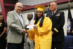 Cadet Aaliyah Lilly receives her essay contest scholarship from YouthQuest Secretary Bill Hall at SCYCA graduation June 10.