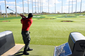 A Capital Guardian ChalleNGe Academy Cadet hits a drive at Topgolf Loudoun during 3D ThinkLink class Vocational Orientation