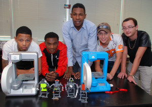 Advanced students with Cube 2 printers during immersion week in the 3D ThinkLink Lab