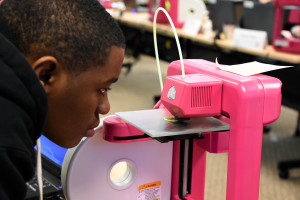 Capital Guardian Youth ChalleNGe Academy graduate Amadou Abakar watches his 3D design take shape on a Cube 2 printer during January 2016 immersion week in YouthQuest's 3D ThinkLink Creativity Lab