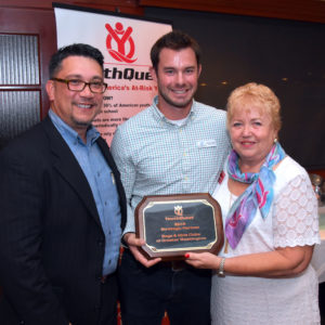 YouthQuest Co-Founder and President Lynda Mann presents the 2016 Strategic Partner Award to Bos & Girls Clubs of Greater Washington board member John Ruff (left) and Program Director Patrick Leonard on August 4.