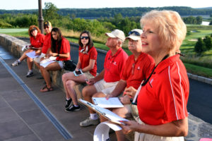 Linda Ackerman organizes volunteers ar YouthQuest's golf tournament on August 8, 2016