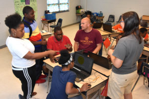 Classroom aide Breanna Fair, teacher Franklin Baker and intern Eleni Fafoutis with 3D ThinkLink class students at Horizons Hampton Roads July 25, 2016