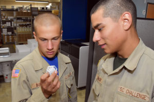 3D ThinkLink students from South Carolina Youth ChalleNGe Academy examine a 3D printed object during a Vocational Orientation visit at Duncan-Parnell's 3D printing shop in Charlotte on October 20, 2016.