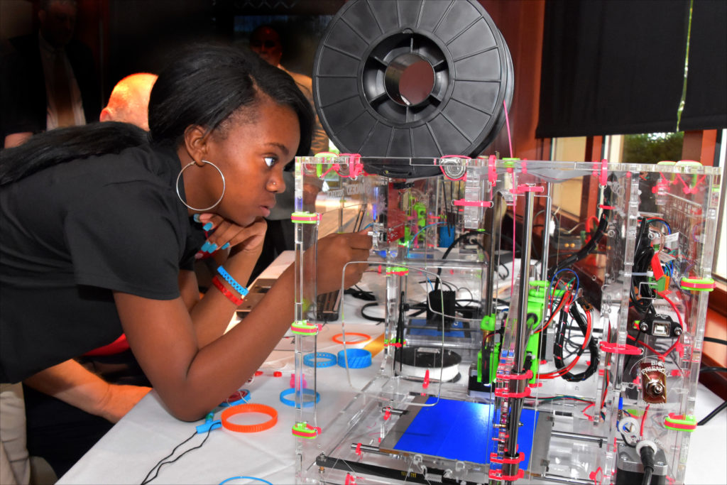 Capital Guardian Youth ChalleNGe Academy graduate NeLazjay Brown operates a 3D printer she assembled during advanced training in YouthQuest’s 3D ThinkLink Creativity Lab on August 4, 2016, in Chantilly, Virginia.