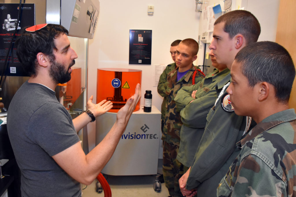 Graduate student Max Lerman shows 3D ThinkLink students from Freestate and Capital Guardian Youth ChalleNGe Academies the 3D printers he uses in the University of Maryland's Tissue Engineering and Biomaterials Lab. The students visited the lab for Vocational Orientation on October 13, 2016.