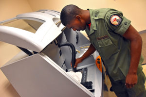 Capital Guardian Youth ChalleNGe Academy Cadet LaMarcus Corley uses the lab's full-color powder printer for the first time during immersion training week in YouthQuest's 3D ThinkLink Creativity Lab June 2017