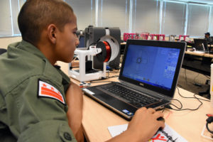 Capital Guardian Youth ChalleNGe Academy Cadet Adrian Vasquez uses Moment of Inspiration 3D software to create a design during immersion training week in YouthQuest's 3D ThinkLink Creativity Lab June 2017 