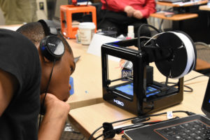 Freestate ChalleNGe Academy Cadet Stephen Brown checks a print on an M3D Micro 3D printer during immersion training week in YouthQuest's 3D ThinkLink Creativity Lab June 2017