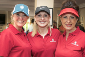 Volunteer of the Year Tammy Haug (center) with volunteers Erica Stewart and Carol Schick from AOC at YouthQuest's 2017 charity golf tournament 