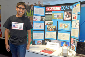 2018 Step Up Loudoun Youth Competition third-prize winner Ari Dixit from Brambleton Middle School with his Citisenship Coach app project display