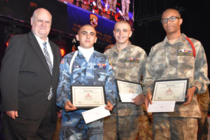 Scholarship winners Trevor Haney, Bradley Berry and Dante Isom with YouthQuest's Tom Meeks at Freestate ChalleNGe Academy graduation on June 23, 2018