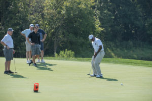 Retired Redskins star Larry Brown and the winning team from Kipps DeSanto at the 2018 YouthQuest Golf Tournament