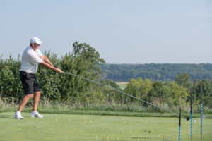 Golf Entertainer Brad Denton wields a 10-foot-long driver at the 2018 YouthQuest golf tournament 