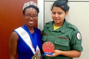 Daniela Aguilar presents the 3D-printed clock she made to Miss Black Maryland USA Saidah Grimes at Capital Guardian Youth ChalleNGe Academy in August, 2017