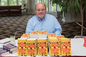 Scorpion Strike author John Gilstrap signed books at the 2018 YouthQuest Golf Tournament reception