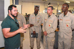 Graduate student Nathan Lambert with 3D ThinkLink students from South Carolina Youth ChalleNGe Academy on a Vocational Orientation tour of the University of North Carolina at Charlotte's Department of Mechanical Engineering