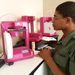 3D ThinkLink scholarship winner Chigaru Todd with 3D printers at Capital Guardian Youth ChalleNGe Academy