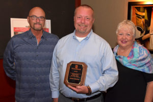 2019 Volunteer of the Year Chris Adams with YouthQuest Foundation Co-Founders Allen Cage and Lynda Mann at VIP Reception August 1, 2019