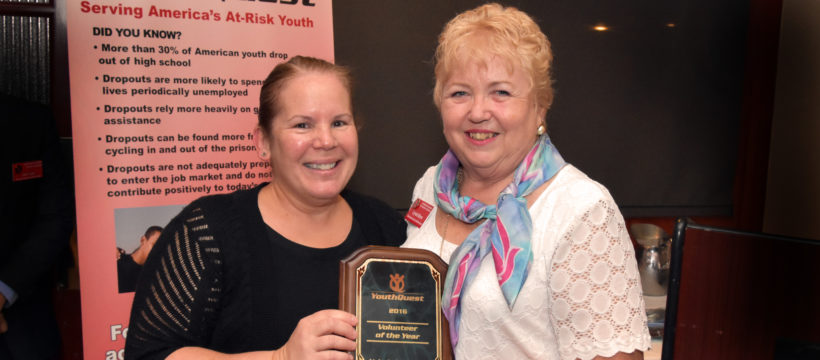 Co-Founder and President Lynda Mann presents YouthQuest's 2016 Volunteer of the Year Award to AOC's Valerie Hightower in August 4