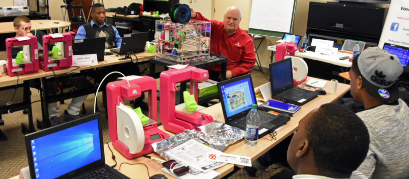 YouthQuest Director of Instruction Tom Meeks with students in the 3D ThinkLink Creativity Lab