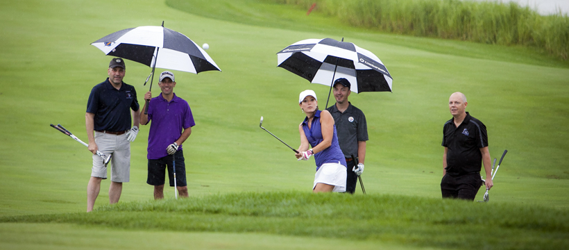 Playing in the rain at YouthQuest Foundation charity golf tournament at Trump National 2017